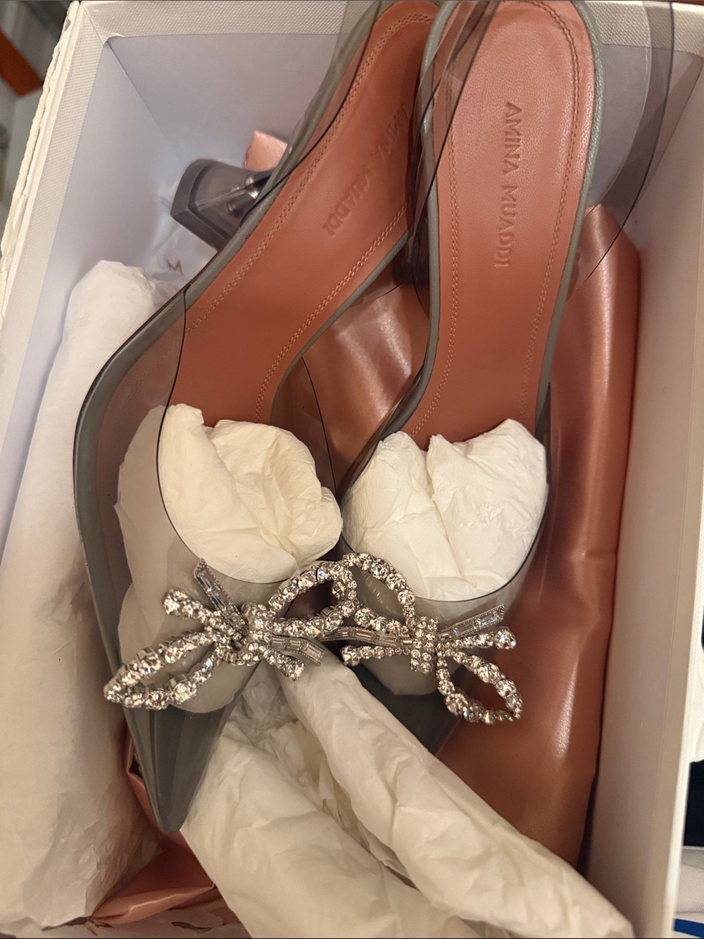 Amina Muaddi Clear PVC Pointed Toe Pump with Crystal Bow and Pink Insole